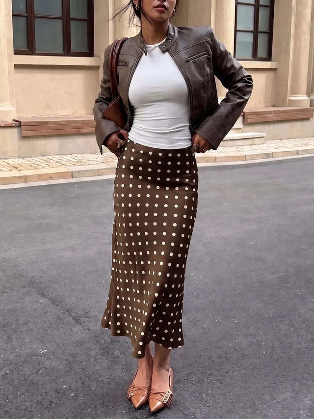 Polka Dot Midi Skirt in brown with white polka dots, a flowing polyester design and mid-calf length.