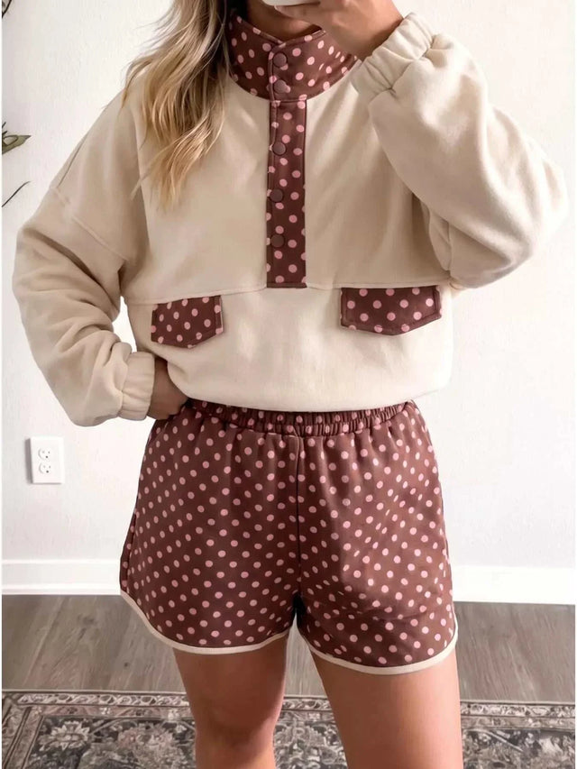 Two-piece pullover and shorts set with Polka Dot Contrast, cream sweatshirt and brown pink-dotted shorts and trim.